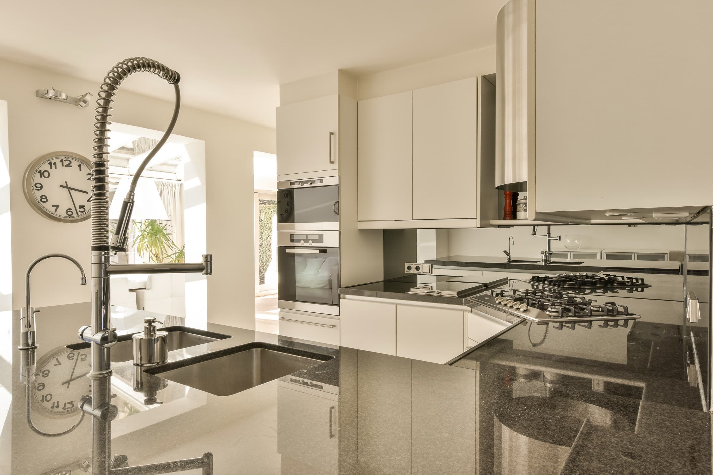 White shaker cabinets, charcoal granite tops