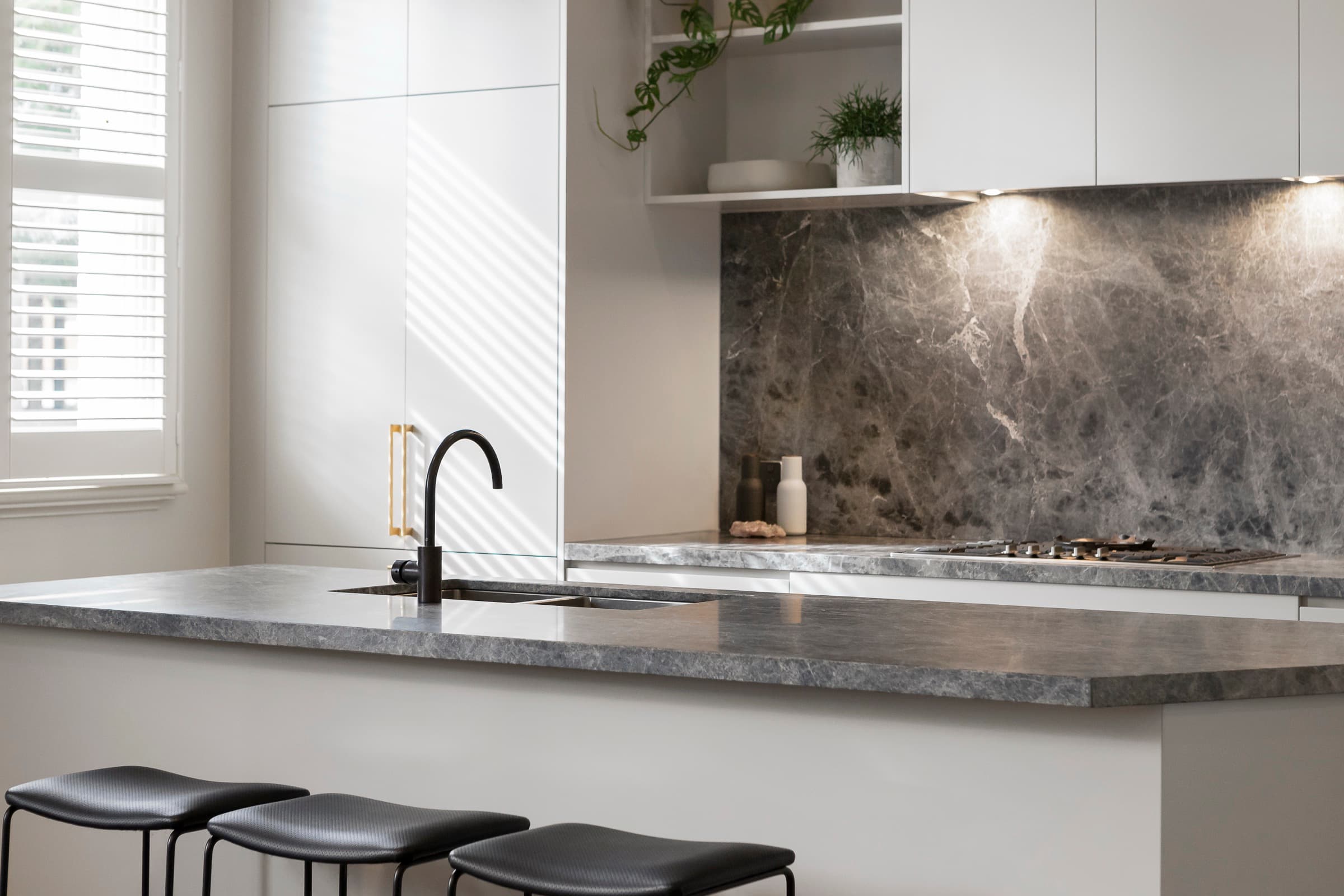 Vein-matched marble backsplash
